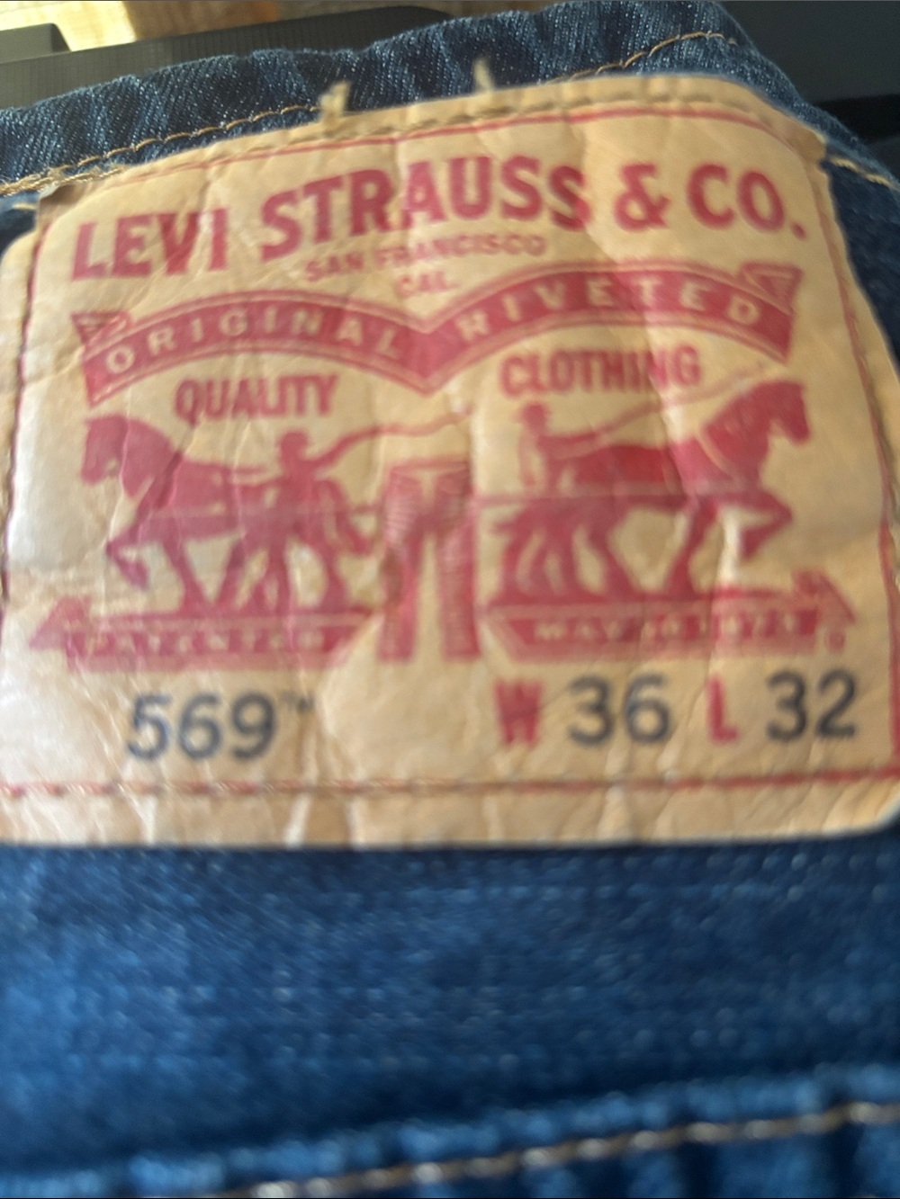 Levi's Men's Relaxed Jeans in Dark Blue with Tan Patch